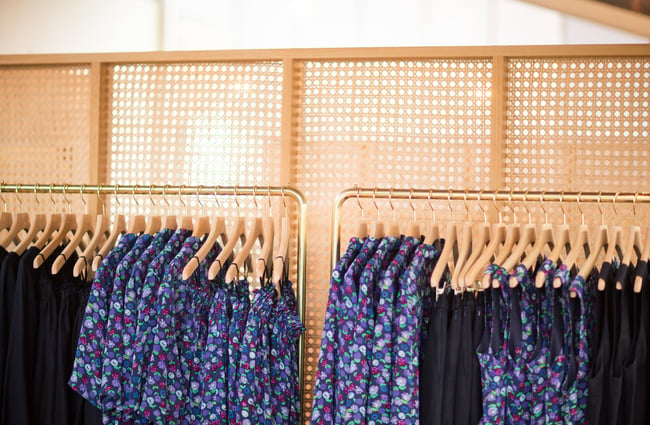 Close up of clothes on a rack.