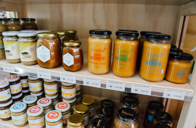Jars of honey on the shelves.