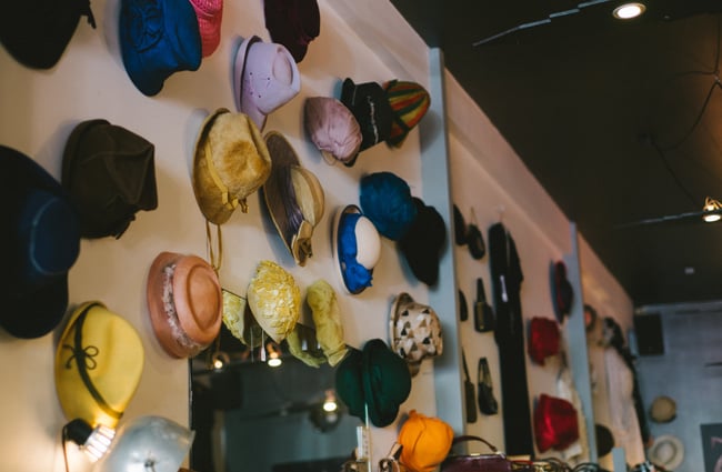 Hats on a wall.