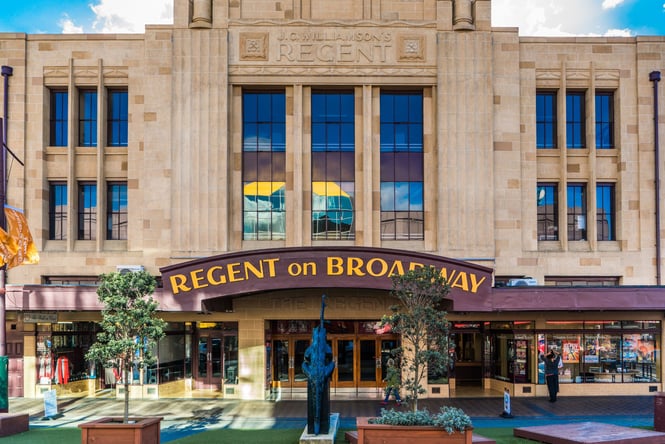 The Regent on Broadway building front with a burgundy coloured archway.