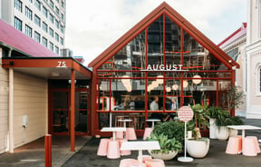 The red and glass exterior of August Eatery.