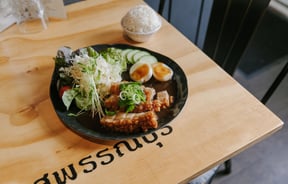 A close up of a plate of Thai food on a table at Bangkok Recipe Oamaru.