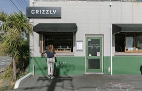 A woman orders at the Grizzly Baked Goods window in Christchurch.