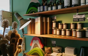 Anglepoise lamp with candles stocked on the shelves at Henry Trading, Lyttelton.