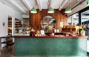 The beautiful green and wood counter area inside Oh My Goodness in Hastings.