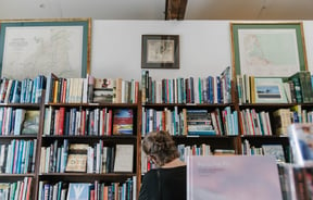 Woman looking at books at Smith's Bookshop, Christchurch.