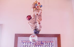 A clown hanging from the ceiling at Circus Circus.