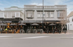 A photo of the front entrance to two iconic Nelson bars, taken from across the street.