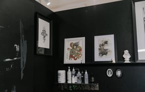 Framed tattoo art on the wall Absolution Tattoo and Body Piercing studio in Christchurch.