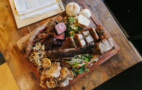 Flatlay of meat platter from El Quincho.