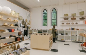 A woman browsing the shelves inside Frances Nation.