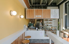 Yellow painted walls inside Grizzly Baked Goods.