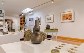 Close up of a bronzed coloured vase at Kiln Gallery.