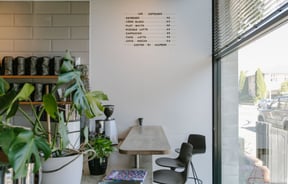 The bench seating next to the counter inside Lux Espresso Christchurch.