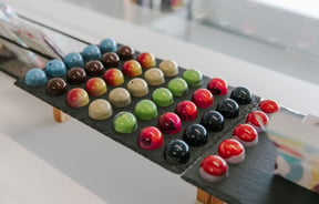 A close up of colourful chocolates on display at Mind Your Temper Christchurch.