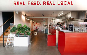 The red and white interior of The Burger Joint.