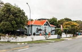 The blue and white Courthouse Cafe building.