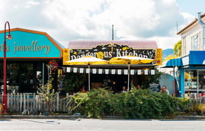 The colourful exterior of The Dangerous Kitchen on a sunny day.