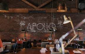 Seating area with exposed brick wall.