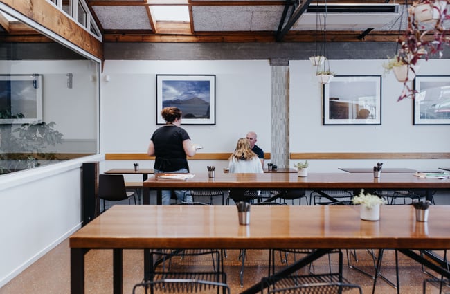 Cafe interior with high tables at Allpress Espresso in Christchurch.