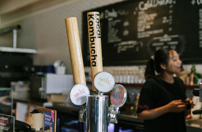 Wooden-handled taps for local kombucha at the bar in Big Fig in Wānaka.