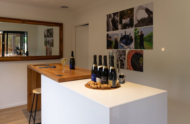 A wine tasting table inside a vineyard.