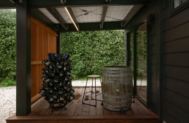 A wine barrel underneath a verandah.
