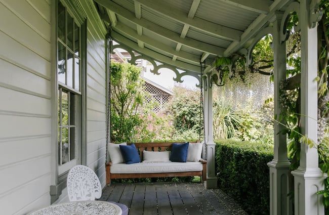 Swinging veranda seat at French Bay House, Akaroa Canterbury.