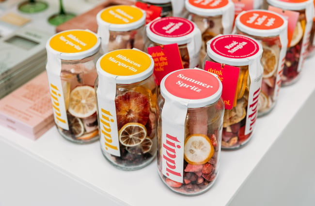 Jars of dried fruit lined up in a row.