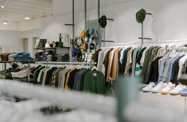 Interior view of the store which racks of clothing lining the walls.