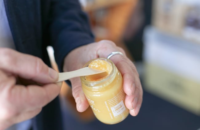Close up of scoop of creamy Honey.