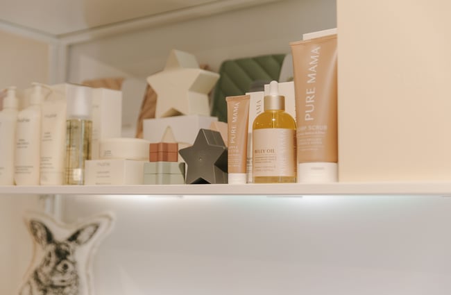 A close up of skincare products on a shelf.