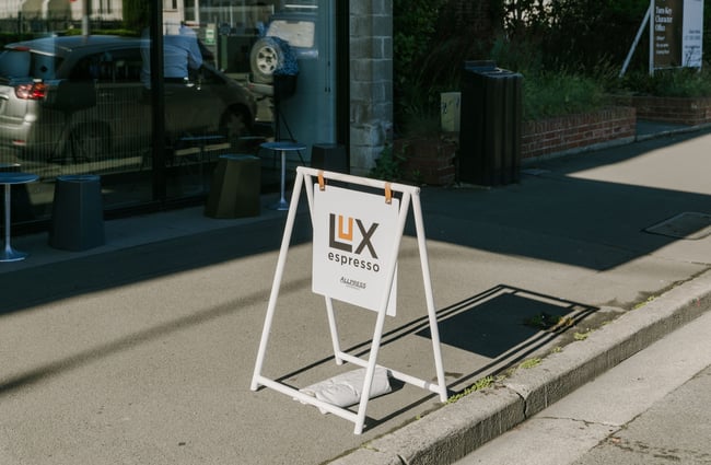 The Lux Espresso swinging sign on the footpath.