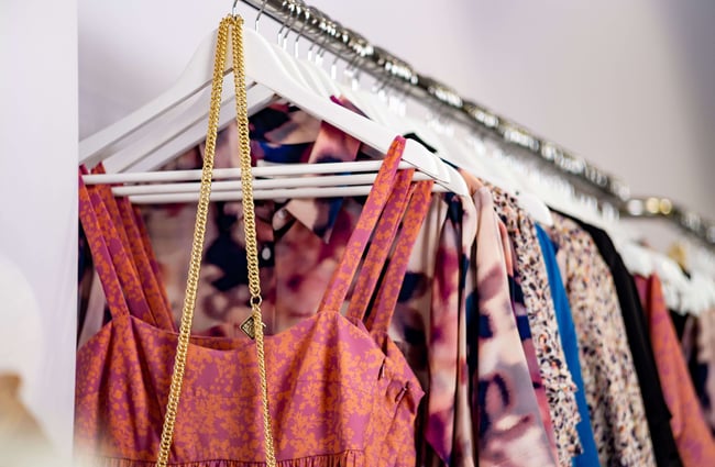 A close up of clothes on a rack.