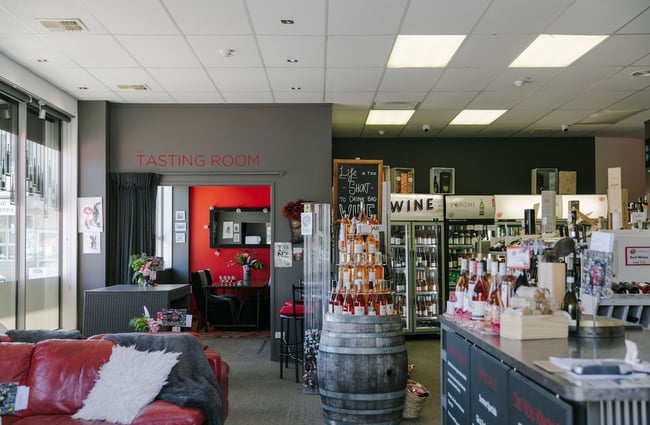Interior of the shop and view to the tasting room entrance at Pembroke Wines & Spirits, Wānaka.