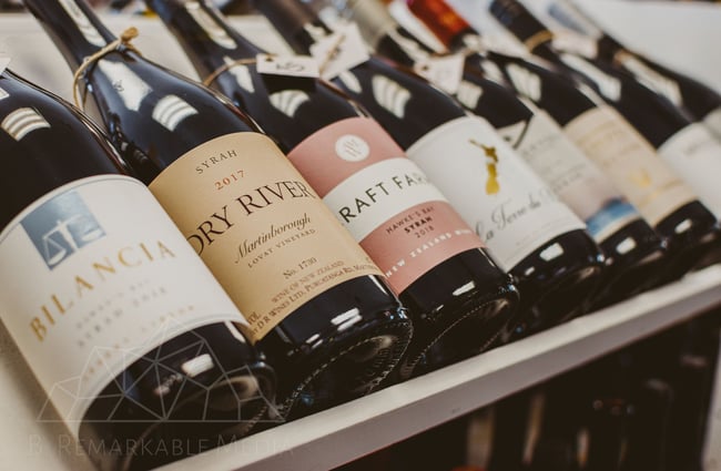 Wide selection of wines on a shelf at Pembroke Wines & Spirits, Wānaka.