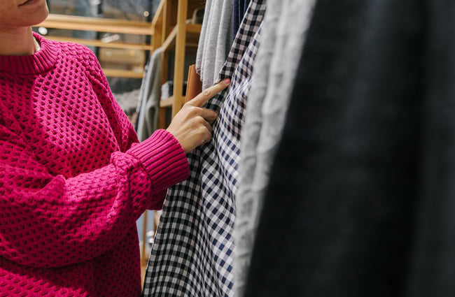 Woman looking at clothing.
