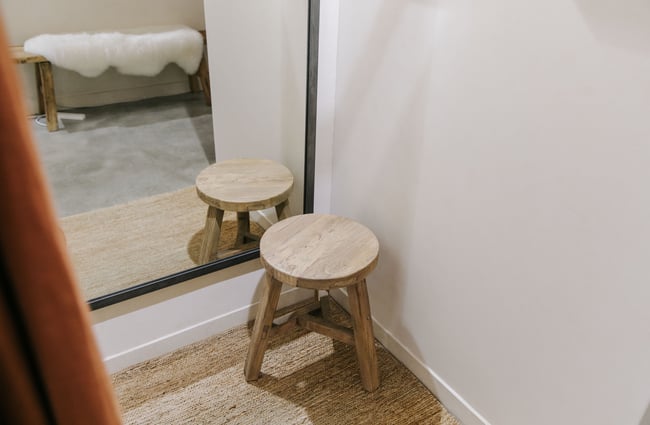 Wooden stool in changing room.