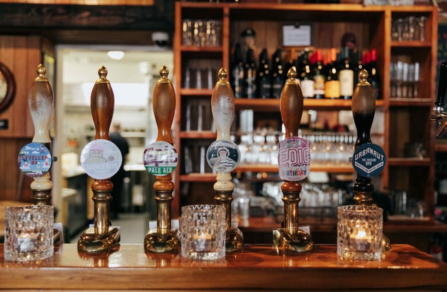 A close up of beer taps at the pub.