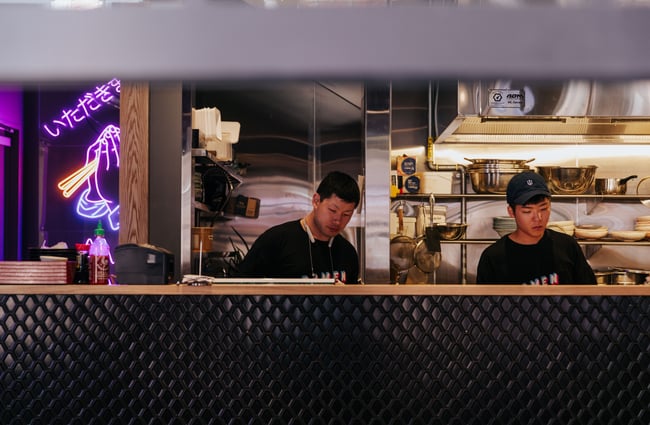Chefs working in a ramen kitchen.