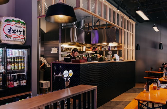 Ramen restaurant with purple mood lighting.