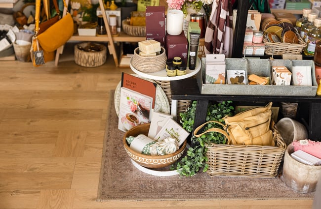Homewares on display on the floor and a table.