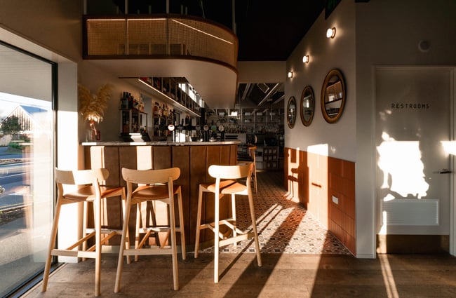 Sunlight shining through the windows onto the bar at The Birdwood, Christchurch.