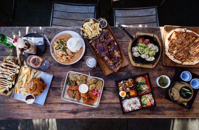 A Birdseye view of plates of food on a table.