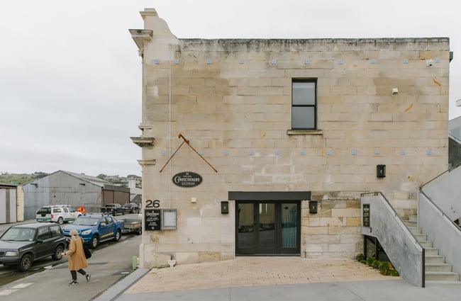 The white stone exterior of The Old Confectionery Oamaru.