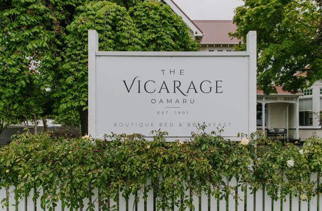 The exterior signage of the Vicarage.