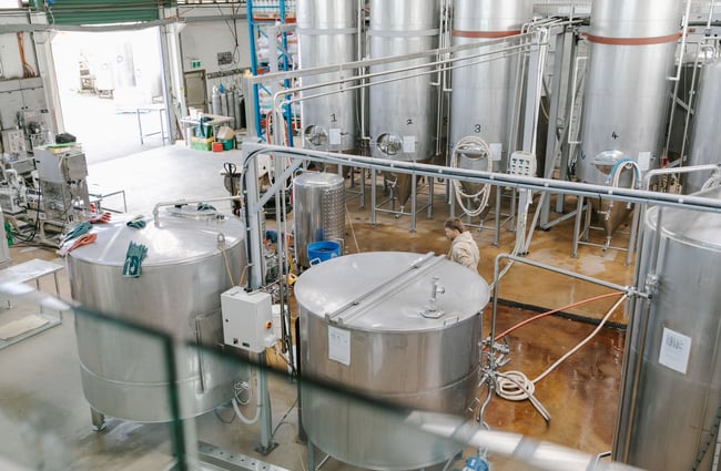 View of the brewery floor and brewing tanks.