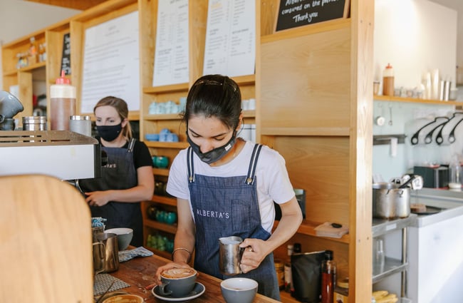 Barista making coffee at Alberta's, Māpua Wharf.