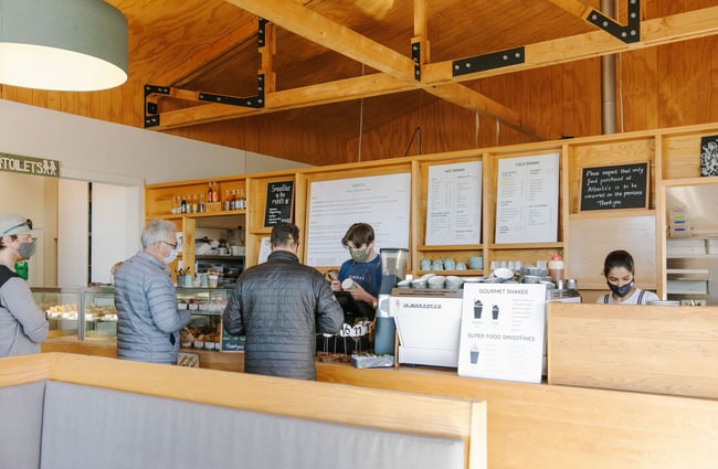 Customers ordering at the till at Alberta's, Māpua Wharf.