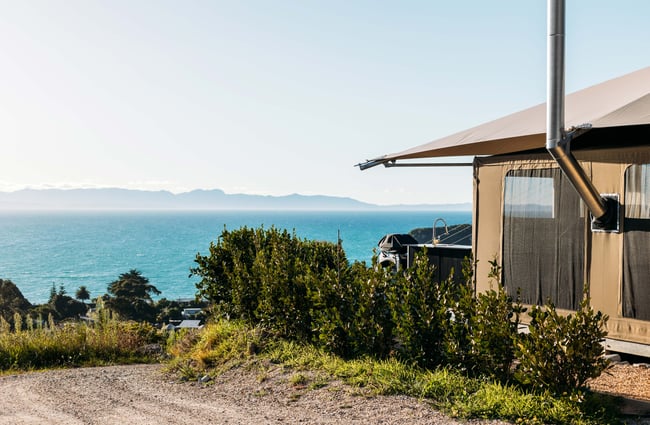 A view of the ocean next to a small building.